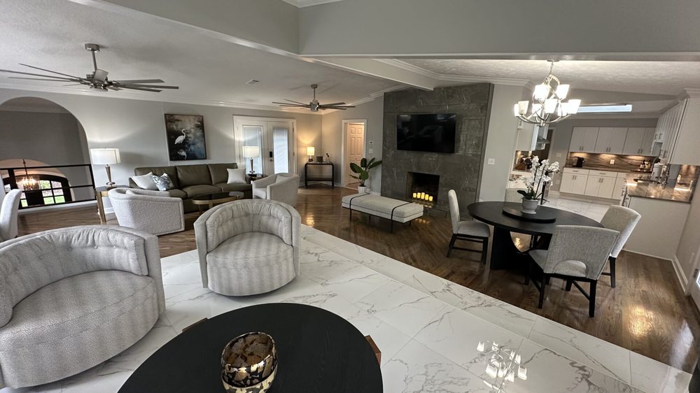 The Magnolia's living room and den looking toward the marble fireplace and open kitchen